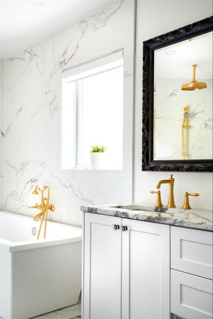marble bathroom stone and golden taps
