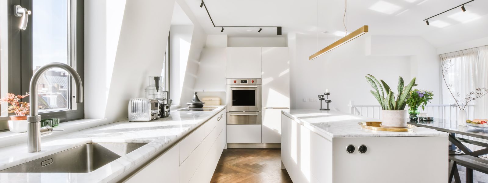 white kitchen with stone worktops